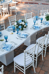 Wedding decor. Elegant table setup in blue pastels.