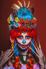 colored,Portrait Of Calavera Catrina on an orange background.Woman dressed as Catrina. Traditional Mexican female skeleton symbolizing death