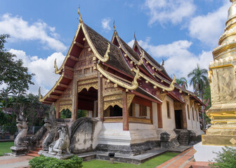 Scenic landscape side view of historic Lanna style viharn Lai Kham inside compound of famous landmark Wat Phra Singh buddhist temple, Chiang Mai, Thailand