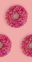 Pattern from a strawberry donuts on pink background to create seamless texture