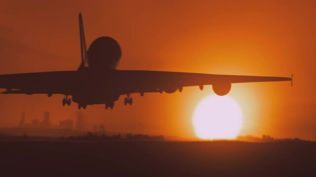 Large passenger jet landing at sunset. 4k footage.