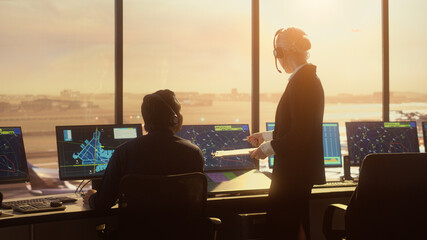 Diverse Air Traffic Control Team Working in Modern Airport Tower at Sunset. Controllers Celebrate...