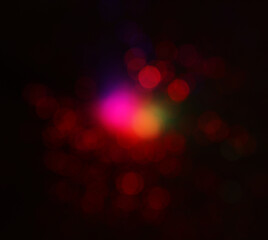 background of abstract red, gold and black glitter lights. defocused