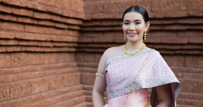 Portrait of Thai woman salute of respect in traditional costume of thailand