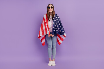 Full body photo of young pretty girl happy positive smile cover herself usa flag nationality isolated over violet background