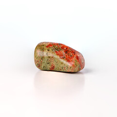 Pink green tumbled stone unakite, shiny mineral piece isolated on white background