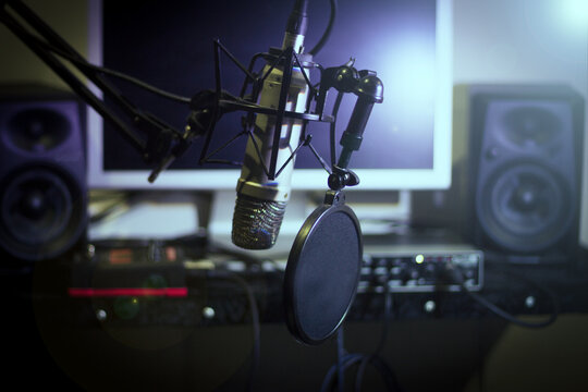 Announcer microphone on recording studio background