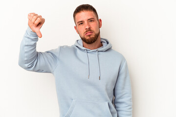 Young caucasian man with diastema isolated on white background showing a dislike gesture, thumbs down. Disagreement concept.