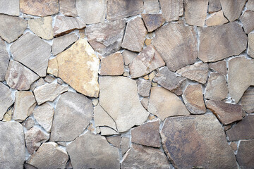 Obraz premium The light brown stone wall texture. Background.