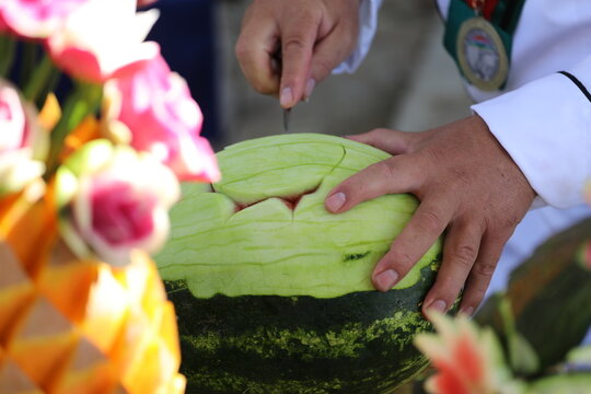 Pumpkin and some vegetables carved with carving knife to get flower design
