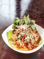Meat fried with chili pepper and red curry sauce