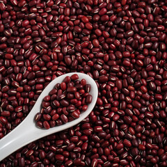 Raw adzuki red bean as background with spoon.