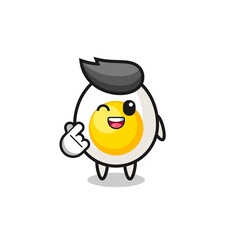 boiled egg character doing Korean finger heart
