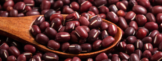 Raw adzuki red bean as background with spoon.