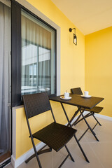 coffee table on the balcony in yellow tones