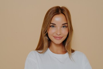 Close up portrait of young smiling beautiful woman with long straight hairstyle