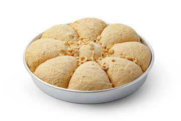 Turkish dessert halva in metal tray isolated on white