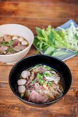 rice noodle soup with pork and vegetables