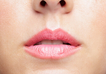 Fototapeta premium Closeup macro portrait of female part of face. Human woman lips with day beauty makeup
