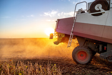 Combine harvester in soybean field