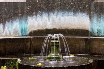 Small water fountain in the city - Powered by Adobe