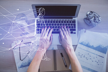 Double exposure of woman hands working on computer and creative hologram drawing. Top View. Start up concept.