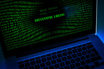 Laptop with green numbers on display. Successful login with credentials user and password in the...