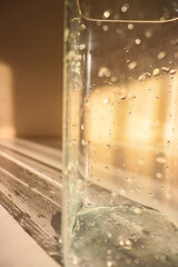 wet vase close-up. glass vase with water drops on it. wet jug close up. drops of water on a vase.glass of water
