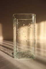 wet vase close-up. glass vase with water drops on it. wet jug close up. drops of water on a vase.glass of water