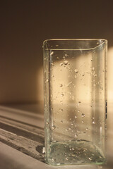 wet vase close-up. glass vase with water drops on it. wet jug close up. drops of water on a vase.glass of water