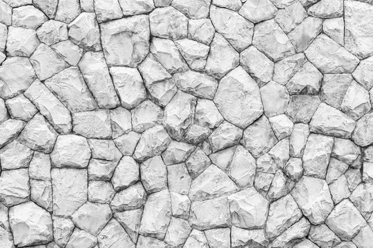 white natural stone wall pattern and background texture © torsakarin
