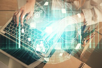 Double exposure of woman hands typing on computer and social network theme hologram drawing. People media concept.