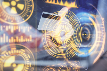 Double exposure of man hands holding a credit card and tech theme drawing. Technology in E-commerce concept.