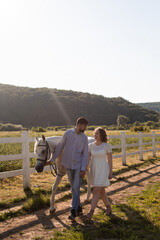 Fototapeta na wymiar Couple walk at the ranch during summer day