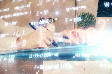 Double exposure of man's hands holding and using a phone and formulas drawing. Education concept.