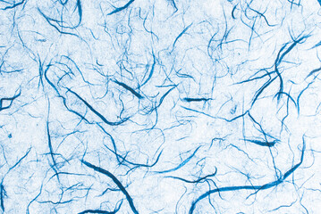 Light blue mulberry paper. Abstract background with small details of paper with natural fibers. Top view for copy spaces, designs, and advertisements