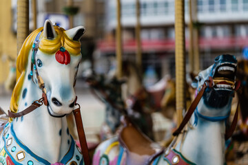 Fairground horses in the city of A Coruna in Galicia, Children's fun in summer. 