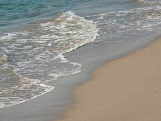 sea waves on the sandy shore of the sun