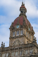 Fototapeta na wymiar Tower and clock of the Town Hall of A Coruna in the Plaza de Maria Pita, in Galicia, Spain 