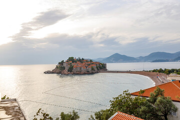 Sveti Stefan sea island  summer sunset with Beach (Montenegro, 6 kilometers southeast of Budva). luxury resort for reach people. Resort includes the islet of Sveti Stefan and part of the mainland