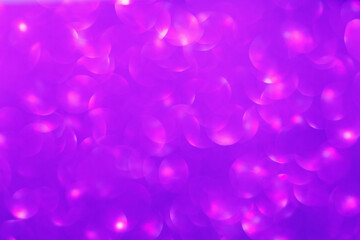 Defocused christmas or party, violet glitter background with bokeh. Holiday glowing backdrop,banner or card.