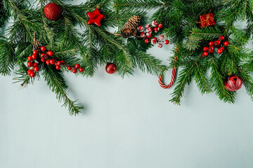 Obraz na płótnie Canvas Christmas frame with fir branches and baubles.