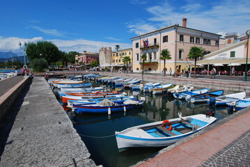 Fototapeta na wymiar Lake Garda, Bardolino, promenade with Fishing boats. Italy, Europe