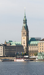 Fototapeta premium In the foreground the Alster Lake in the background the town hall of Hamburg. Germany, Europe