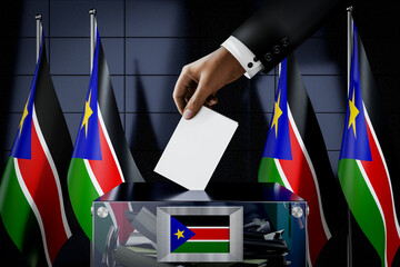 South Sudan flags, hand dropping ballot card into a box - voting, election concept - 3D illustration