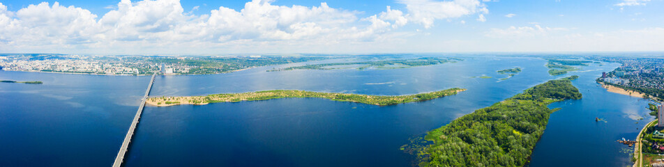a panoramic view of the banks of the Volga River near Saratov, an automobile bridge across the river in the city limits