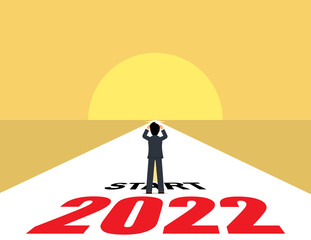 Fototapeta premium Businessman standing plans for the beginning of 2022. business strategy, opportunity, new life change for 2021-2022.