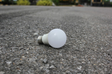 light bulb on a gravel road
