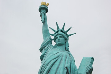 Fototapeta premium Statue of Liberty National Monument with blue sky background.