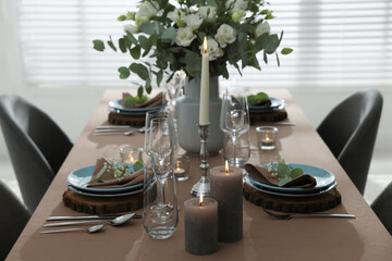 Festive table setting with beautiful tableware and decor indoors